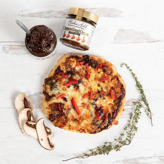 Blake Hill Caramelized Onion Savory Jam next to a pizza .