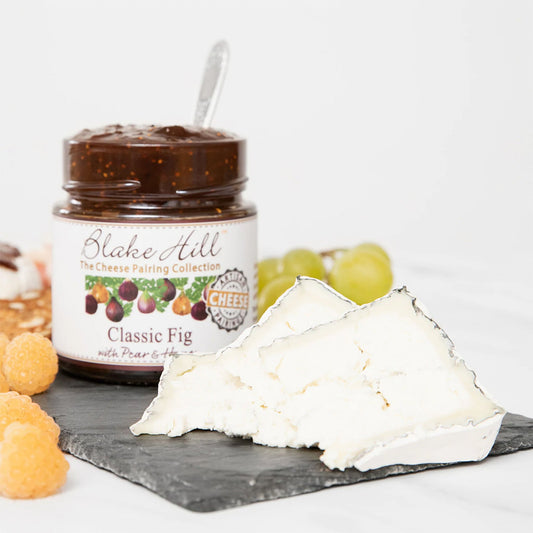 Blake Hill Classic Fig with Pear & Honey Preserves on slate cheese board with a soft cheese.