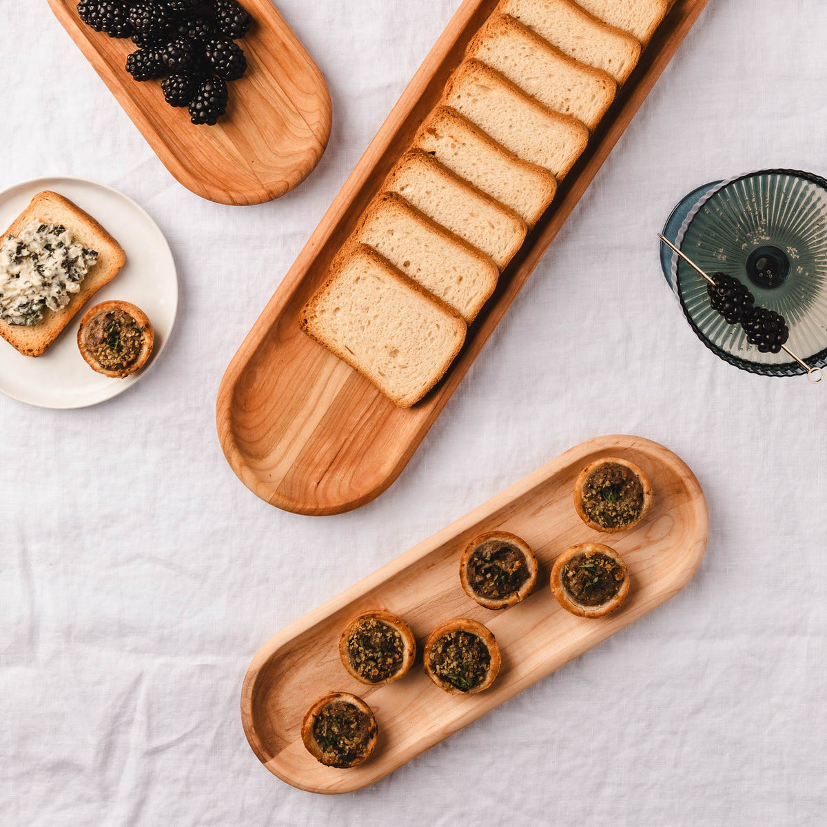Cherry appetizer trays with appetizers in set of three.
