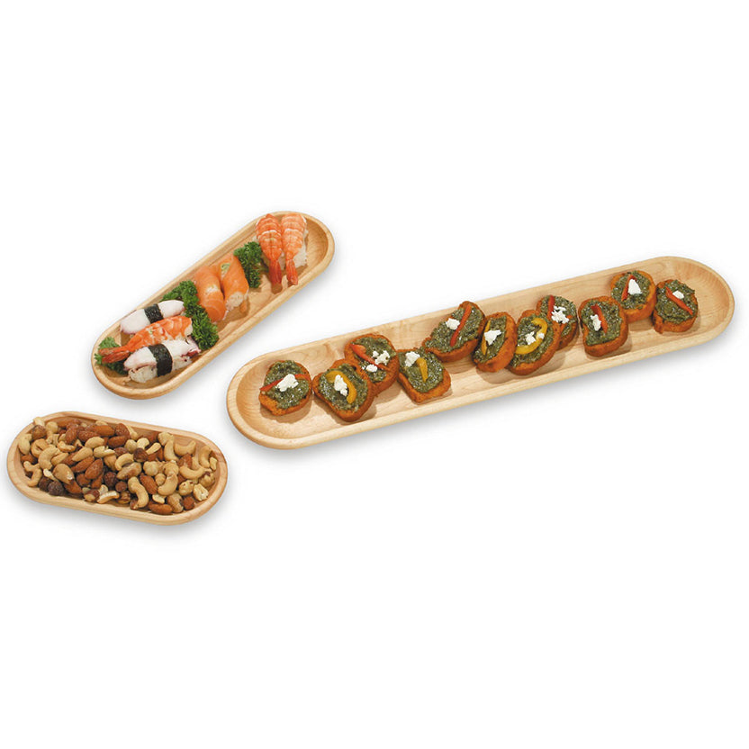 Three light natural wood serving trays arranged on a white background, holding sushi rolls, a small bowl of nuts, and a long tray of stuffed sushi pieces.