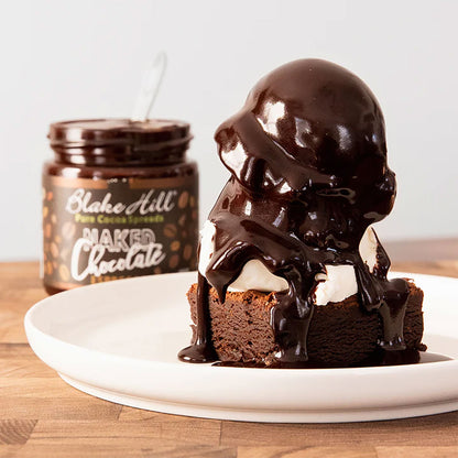 Chocolate dessert with a jar of chocolate spread on a wooden surface