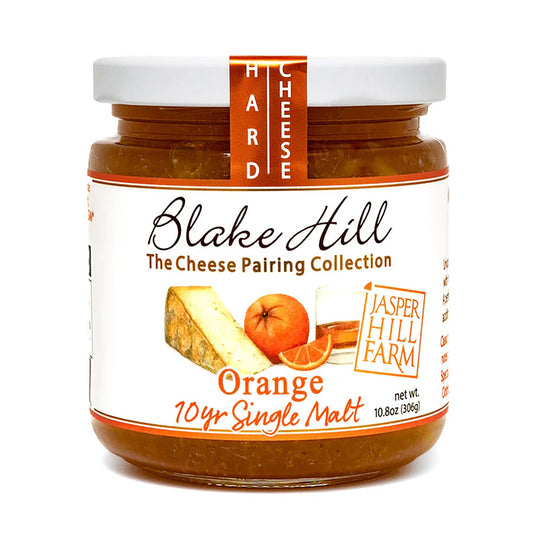 Jar of Blake Hill Hard Cheese with orange flavor on a white background