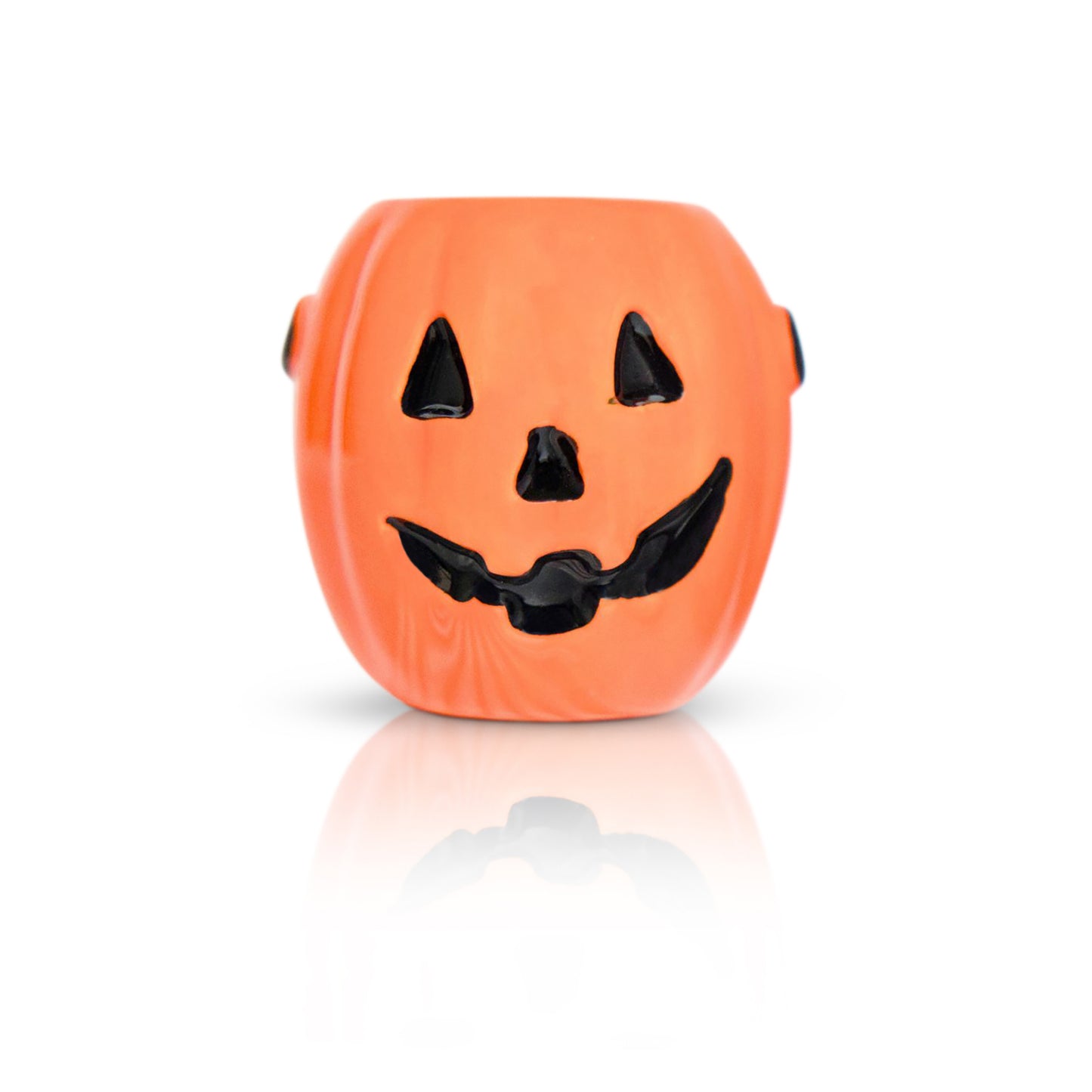 An orange jack-o'-lantern-shaped bead with a black painted face, shown on a clean white background with a soft reflection below.